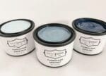 three pint containers of blue, gray and light blue clay furniture paint