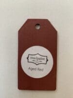 Small wooden tag hand painted with red paint