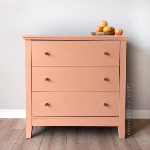 large dresser painted in pink orange mudpaint clay furniture paint