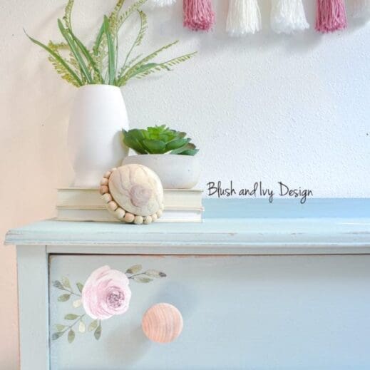 large dresser painted with light blue green clay paint