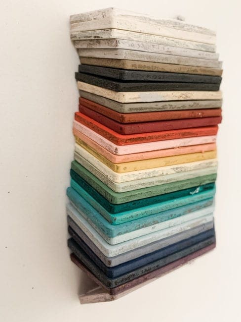 Stack of small wooden tag hand painted with clay furniture paint