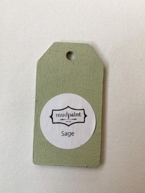 Small wooden tag hand painted with light green clay furniture paint