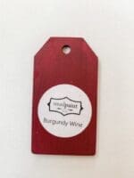 Small wooden tag hand painted with burgundy red clay furniture paint
