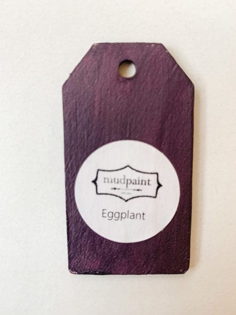 Small wooden tag hand painted with deep purple clay furniture paint