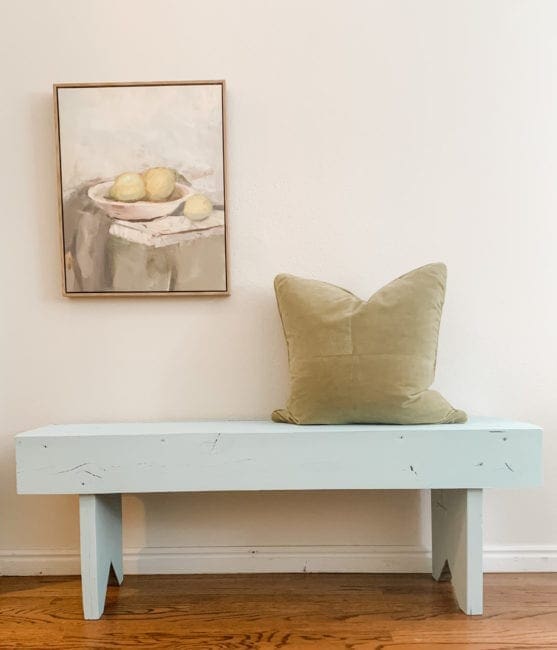 A bench painted with aqua clay furniture paint from MudPaint