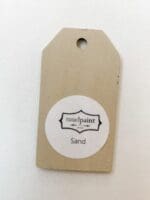 Small wooden tag hand painted with tan clay furniture paint