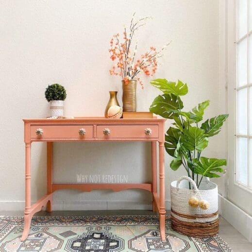 very small desk painted in orange clay furniture paint