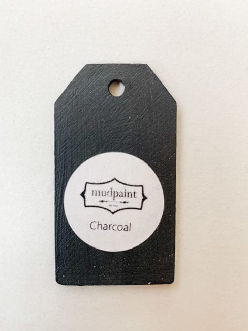 Small wooden tag hand painted with dark gray clay furniture paint
