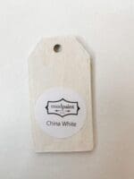 Small wooden tag hand painted with off white clay furniture paint