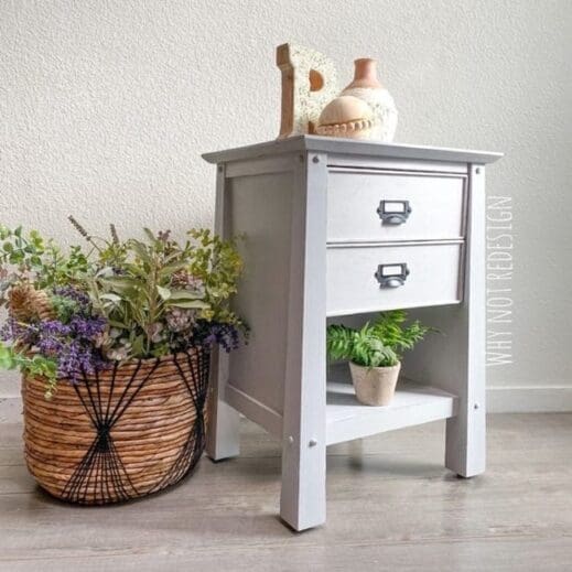 A night stand with plants and painted in a light gray clay furniture paint