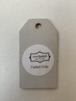 Small wooden tag hand painted with light gray clay furniture paint