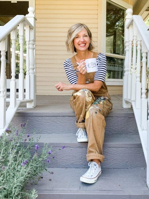 company owner and founder of Mudpaint clay furniture paint sitting on a front porch