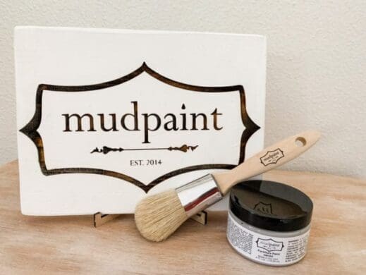 mudpaint clay furniture paint branded sign sitting on an easel with a white backdrop