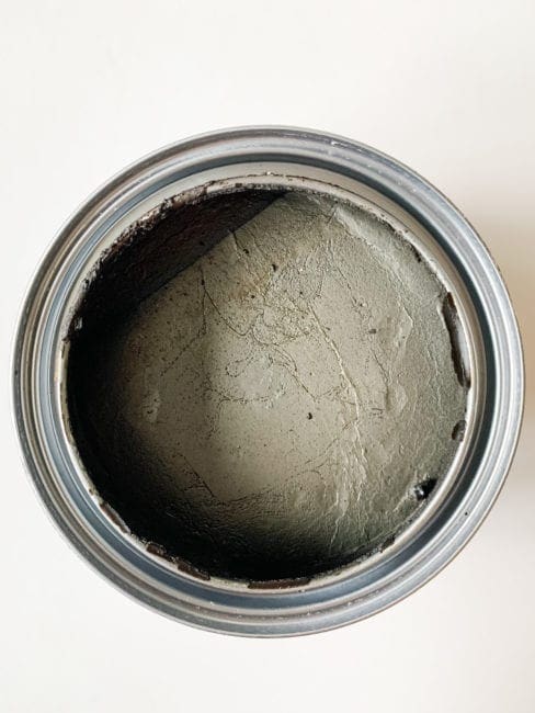 top view of open container with MudPaint dark finishing wax for furniture