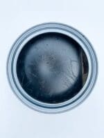top view of open MudPaint black finishing wax for furniture