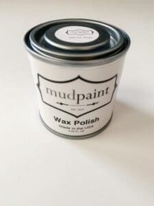 Container of mudpaint white liming wax on a white backdrop