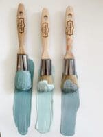 Three MudPaint brushes with shades of blue, gray and aqua clay furniture paint