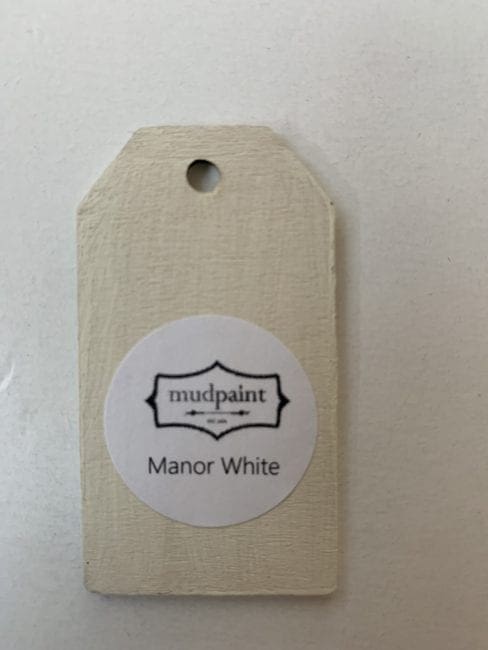 Small wooden tag hand painted with off white paint color