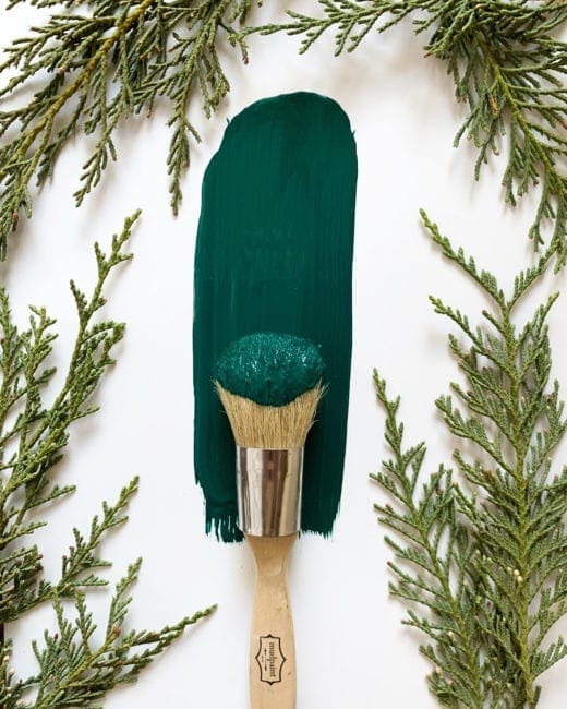 dark green clay furniture paint brushed with festive greens placed around
