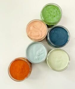 several open containers of clay furniture paint colors