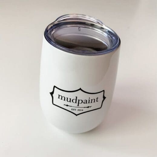 mudpaint branded coffee cup tumbler sitting on a white backdrop