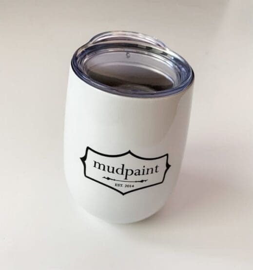 mudpaint branded coffee cup tumbler sitting on a white backdrop