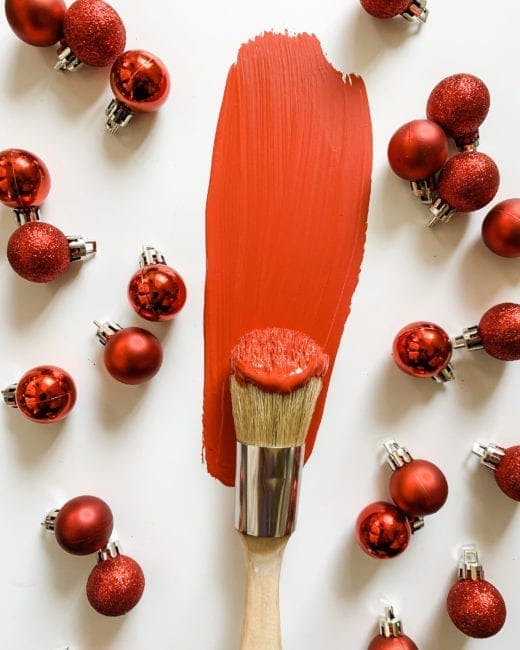 painted brush with MudPaint pomegranate red clay furniture paint with seasonal ornaments