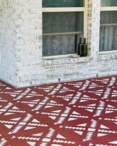 concrete floor painted in dark red clay furniture paint by MudPaint