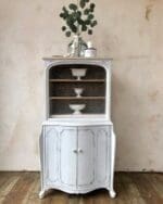 small hutch painted in light pale blue neutral clay furniture paint from MudPaint