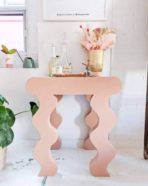 Decorative small table painted in light pink clay furniture paint by MudPaint