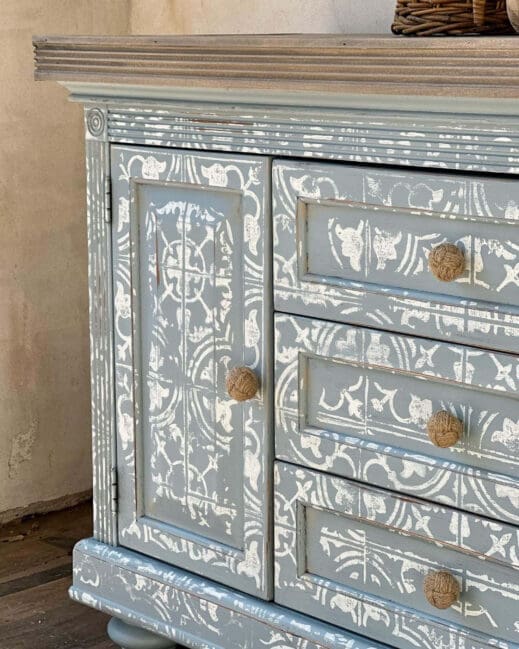 beautifully stencilled cabinet painted in light baby blue suede blue clay furniture paint by MudPaint