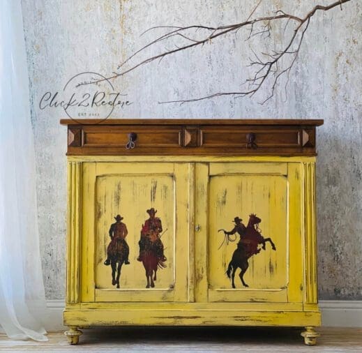 Double sided painted cabinet stenciled with western figures and painted in golden yellow Butternut Clay Furniture paint by MudPaint