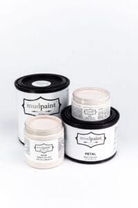 assorted containers of light soft pink neutral pink clay furniture paint