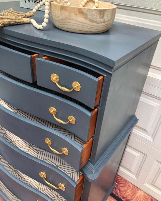 Large dresser cabinet with gold plated hardware and painted in steel blue storm clay furniture paint by MudPaint