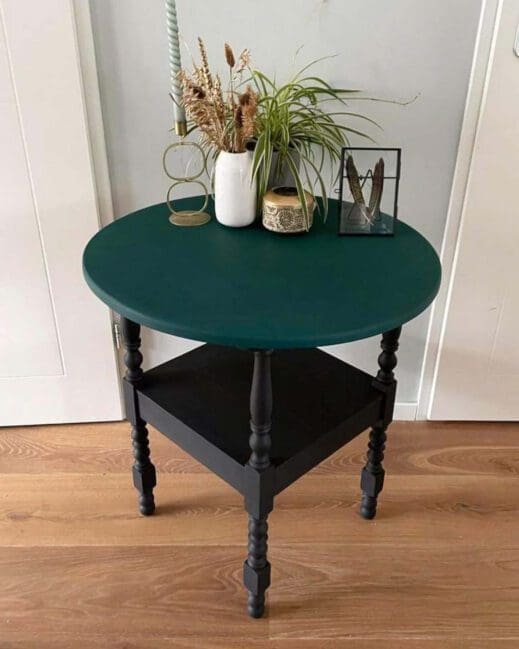 Small end table covered with dark green forest green MudPaint clay furniture paint